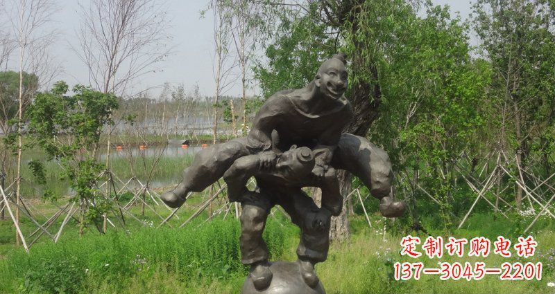 福建园林站在球上面跳山羊的人物景观铜雕